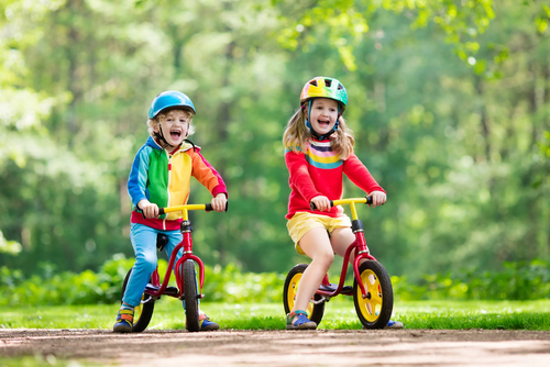toddler and kids riding balance bikes